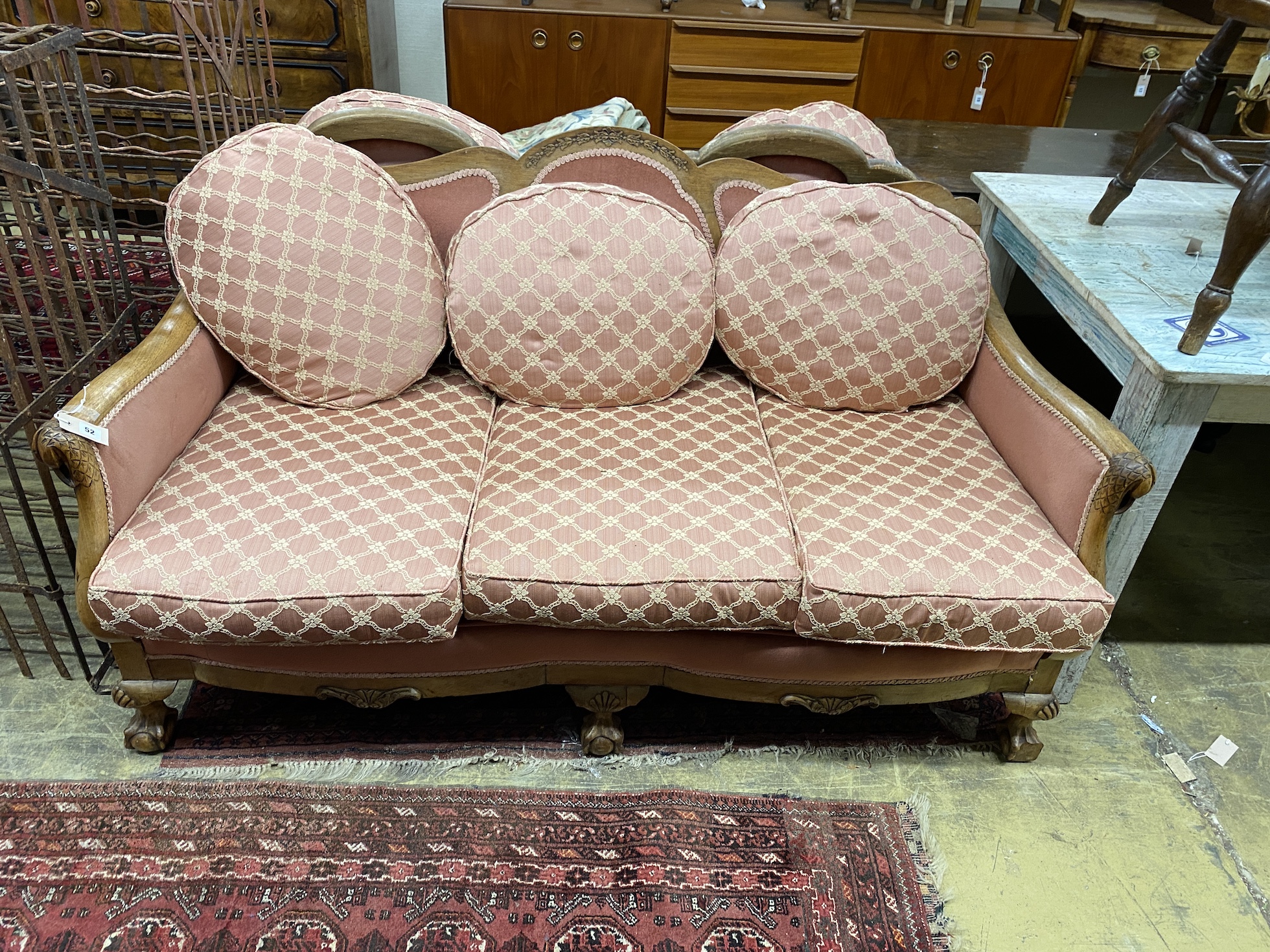 An early 20th century faded mahogany three piece suite, settee length 163cm, depth 85cm, height 80cm